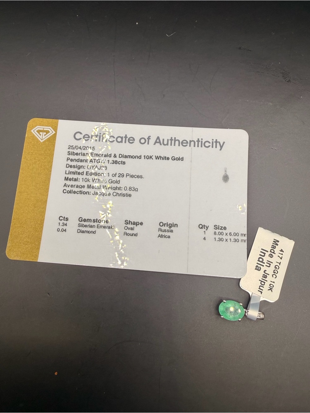 10k white Gold 1.38 Ctw Emerald & Diamond Pendant.